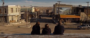 Movie still from “Thor” (2011), directed by Kenneth Branagh – A group of people sitting on top of a building; Wide shot, High angle