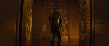 Movie still from “Thor” (2011), directed by Kenneth Branagh – A man dressed as thor standing in front of a wall; Wide shot, Low angle