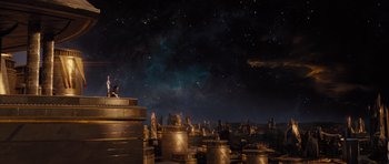 Movie still from “Thor” (2011), directed by Kenneth Branagh – A man sitting on top of a stack of metal barrels; Extreme Wide shot, High angle