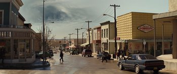 Movie still from “Thor” (2011), directed by Kenneth Branagh – People walking down the street on a cloudy day; Extreme Wide shot, Low angle