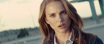 Movie still from “Thor” (2011), directed by Kenneth Branagh – A person with long brown hair; Close Up shot, Over the shoulder angle