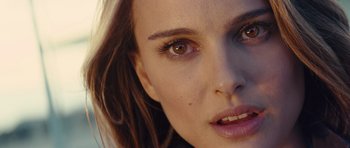 Movie still from “Thor” (2011), directed by Kenneth Branagh – A woman's face with brown eyes; Close Up shot, Over the shoulder angle