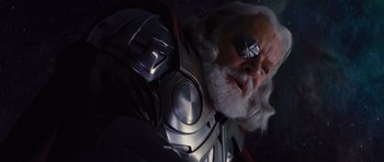Movie still from “Thor” (2011), directed by Kenneth Branagh – An old man with a beard and a silver helmet; Close Up shot, Low angle