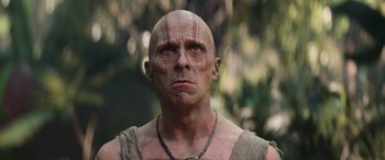 Movie still from “Thor: Love and Thunder” (2022), directed by Taika Waititi – A bald man is looking at the camera; Close Up shot, Low angle