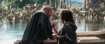 Movie still from “Thor: Love and Thunder” (2022), directed by Taika Waititi – A man and a woman holding each other's hands; Medium shot, Over the shoulder angle
