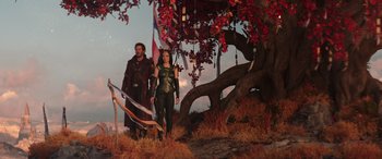 Movie still from “Thor: Love and Thunder” (2022), directed by Taika Waititi – A man and a woman standing next to each other in front of a tree; Wide shot, Over the shoulder angle