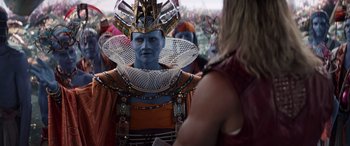 Movie still from “Thor: Love and Thunder” (2022), directed by Taika Waititi – A man in a costume is looking into a mirror; Close Up shot, Over the shoulder angle