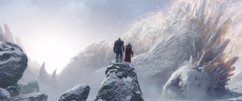 Movie still from “Thor: Love and Thunder” (2022), directed by Taika Waititi – A man and a woman standing on top of a mountain; Extreme Wide shot, Low angle