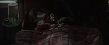 Movie still from “Thor: Love and Thunder” (2022), directed by Taika Waititi – A little girl laying in bed with a teddy bear; Close Up shot, High angle