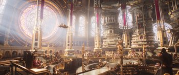 Movie still from “Thor: Love and Thunder” (2022), directed by Taika Waititi – A large room filled with lots of gold colored decorations; Extreme Wide shot, High angle