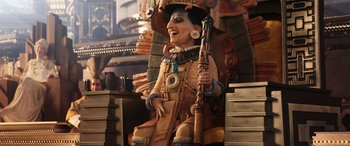 Movie still from “Thor: Love and Thunder” (2022), directed by Taika Waititi – A statue of an indian holding a rifle in his hand; Wide shot, Low angle