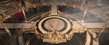 Movie still from “Thor: Love and Thunder” (2022), directed by Taika Waititi – An aerial view of a stage with people standing on it; Extreme Wide shot, Overhead angle