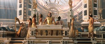 Movie still from “Thor: Love and Thunder” (2022), directed by Taika Waititi – A group of people standing in front of a statue; Wide shot, Low angle