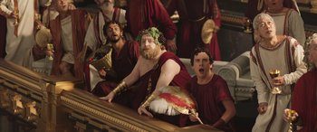 Movie still from “Thor: Love and Thunder” (2022), directed by Taika Waititi – A group of men dressed in ancient roman garb; Medium shot, Low angle