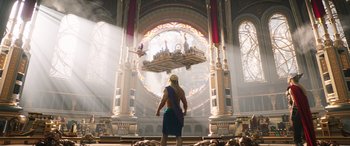 Movie still from “Thor: Love and Thunder” (2022), directed by Taika Waititi – A man standing in front of a large window; Extreme Wide shot, Low angle