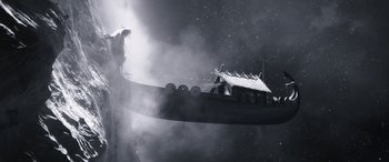 Movie still from “Thor: Love and Thunder” (2022), directed by Taika Waititi – A boat floating on top of a body of water at night; Extreme Wide shot, Low angle