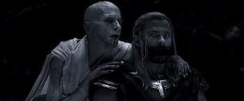 Movie still from “Thor: Love and Thunder” (2022), directed by Taika Waititi – Two men dressed in costume for a movie; Close Up shot, Over the shoulder angle