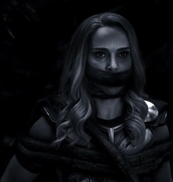 Movie still from “Thor: Love and Thunder” (2022), directed by Taika Waititi – A black and white photo of a woman tied to a rope; Close Up shot, High angle