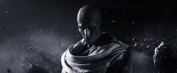 Movie still from “Thor: Love and Thunder” (2022), directed by Taika Waititi – An old man wearing a black robe and a white scarf; Close Up shot, Low angle