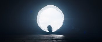 Movie still from “Thor: Love and Thunder” (2022), directed by Taika Waititi – A man kneeling down in front of an opening in the sky; Extreme Wide shot, High angle