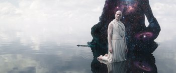 Movie still from “Thor: Love and Thunder” (2022), directed by Taika Waititi – An image of a man that is standing in the water; Wide shot, Overhead angle