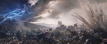 Movie still from “Thor: Love and Thunder” (2022), directed by Taika Waititi – A large group of people are fighting in a field; Extreme Wide shot, High angle
