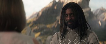 Movie still from “Thor: Love and Thunder” (2022), directed by Taika Waititi – A person with dreads; Close Up shot, Over the shoulder angle