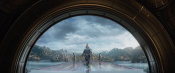 Movie still from “Thor: Ragnarok” (2017), directed by Taika Waititi – A man is standing in front of a large window; Extreme Wide shot, Low angle