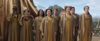 Movie still from “Thor: Ragnarok” (2017), directed by Taika Waititi – A group of people standing next to each other; Medium shot, Low angle