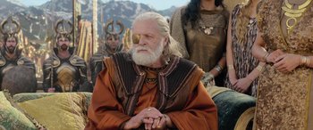 Movie still from “Thor: Ragnarok” (2017), directed by Taika Waititi – An old man with a white beard wearing a pirate eye patch; Medium shot, Low angle