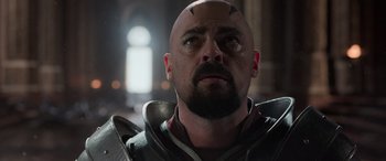 Movie still from “Thor: Ragnarok” (2017), directed by Taika Waititi – A man with a bald head looking up at the sky; Close Up shot, Low angle