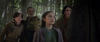 Movie still from “Thor: Ragnarok” (2017), directed by Taika Waititi – A group of people standing next to each other in the woods; Medium shot, Low angle