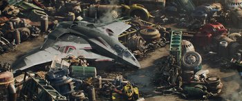 Movie still from “Thor: Ragnarok” (2017), directed by Taika Waititi – An airplane sitting on top of an industrial area; Extreme Wide shot, High angle