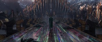 Movie still from “Thor: Ragnarok” (2017), directed by Taika Waititi – An image of a man with horns in the middle of a road; Extreme Wide shot, Overhead angle