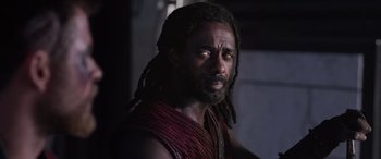 Movie still from “Thor: Ragnarok” (2017), directed by Taika Waititi – A person with dreadlocks; Close Up shot, Over the shoulder angle