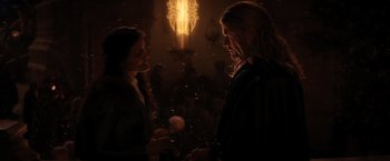 Movie still from “Thor: The Dark World” (2013), directed by Alan Taylor – Two people standing next to each other in front of a light; Medium shot, Over the shoulder angle