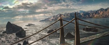 Movie still from “Thor: The Dark World” (2013), directed by Alan Taylor – A view of a body of water with mountains in the background; Extreme Wide shot, High angle