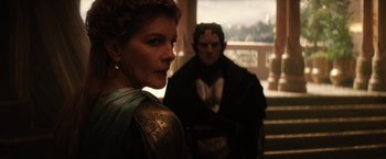 Movie still from “Thor: The Dark World” (2013), directed by Alan Taylor – A man and a woman standing next to each other; Medium shot, Over the shoulder angle