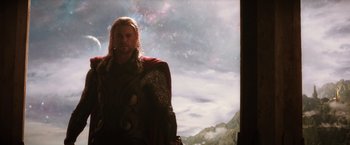 Movie still from “Thor: The Dark World” (2013), directed by Alan Taylor – A person wearing a thor costume; Medium shot, Low angle