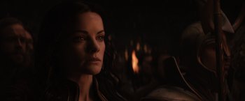 Movie still from “Thor: The Dark World” (2013), directed by Alan Taylor – A woman's face in the dark; Close Up shot, Over the shoulder angle