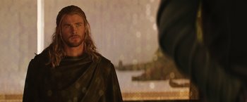 Movie still from “Thor: The Dark World” (2013), directed by Alan Taylor – A person with long blond hair; Close Up shot, Over the shoulder angle