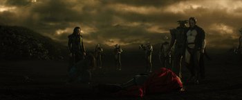 Movie still from “Thor: The Dark World” (2013), directed by Alan Taylor – A group of people standing in a field; Wide shot, Low angle