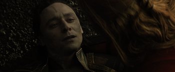 Movie still from “Thor: The Dark World” (2013), directed by Alan Taylor – A man with a bald head is looking at the camera; Close Up shot, Over the shoulder angle