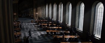 Movie still from “Thor: The Dark World” (2013), directed by Alan Taylor – People are sitting at tables in a large room; Extreme Wide shot, High angle