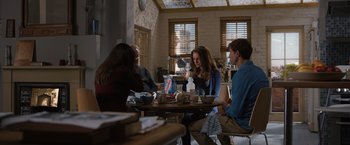 Movie still from “Thor: The Dark World” (2013), directed by Alan Taylor – A group of people sitting around a table; Wide shot, High angle