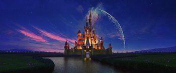 An image of a large castle in the middle of the night