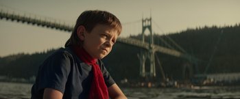 Movie still from “Timmy Failure: Mistakes Were Made” (2020), directed by Tom McCarthy – A young boy wearing a red scarf and a blue t - shirt; Close Up shot, Low angle