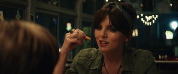 Movie still from “Timmy Failure: Mistakes Were Made” (2020), directed by Tom McCarthy – A person holding a piece of food; Close Up shot, Over the shoulder angle