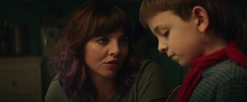 Movie still from “Timmy Failure: Mistakes Were Made” (2020), directed by Tom McCarthy – A woman sitting next to a young boy in front of a mirror; Close Up shot, Over the shoulder angle