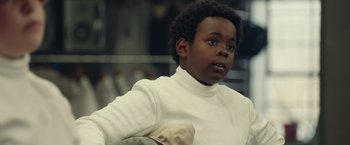Movie still from “Timmy Failure: Mistakes Were Made” (2020), directed by Tom McCarthy – A boy in a white shirt is fencing; Close Up shot, Low angle